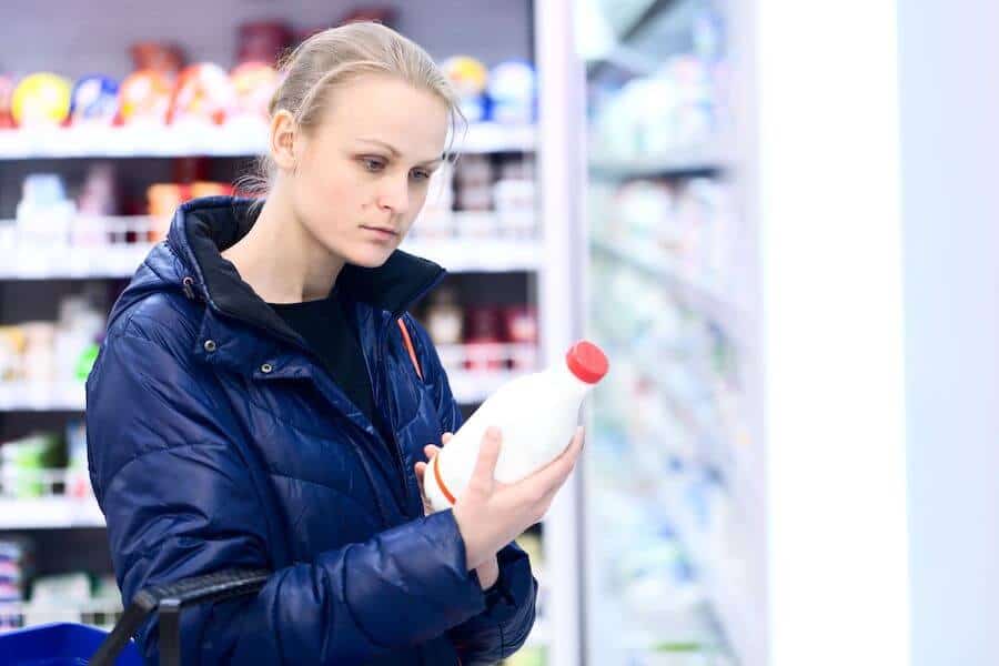 women shopping for oat milk