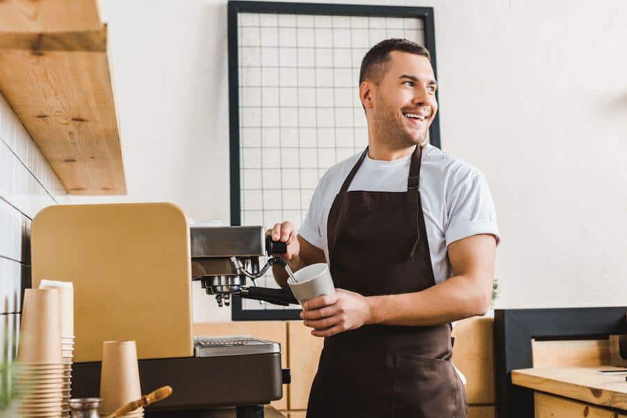 barista frothing oat milk