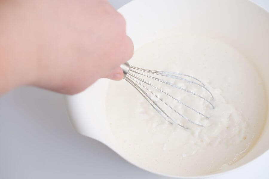 whisking oat milk foam