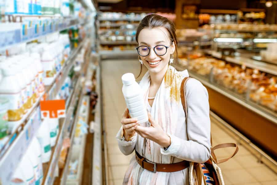 women buying oat milk