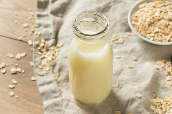 oat milk jug and oats